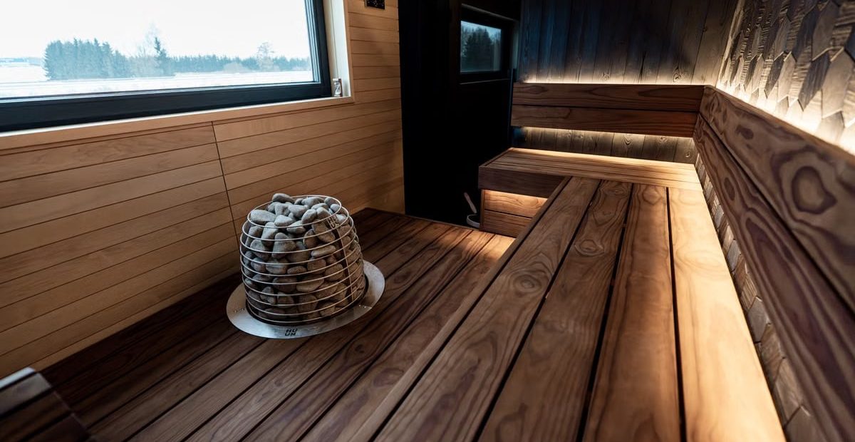 Experience a sleek Nordic sauna interior with modern wood design and LED lighting.